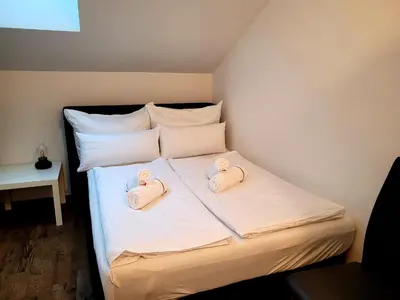 Ein Bett oder Betten in einem Zimmer der Unterkunft Ferienwohnung Lindpointner