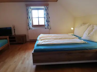 Ein Bett oder Betten in einem Zimmer der Unterkunft Paulbauer