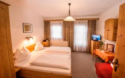 Ein Bett oder Betten in einem Zimmer der Unterkunft Pension Grafengut