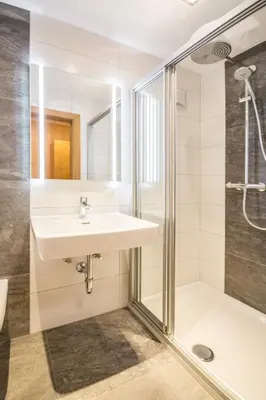 Ein Badezimmer in der Unterkunft Haus Alpenland