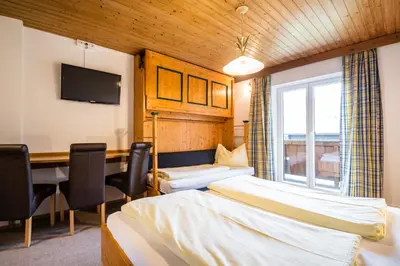 Ein Bett oder Betten in einem Zimmer der Unterkunft Haus Alpenland