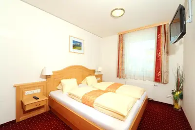 Ein Bett oder Betten in einem Zimmer der Unterkunft Hotel-Restaurant Kirchenwirt Aigen