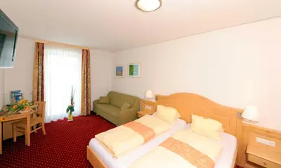 Ein Bett oder Betten in einem Zimmer der Unterkunft Hotel-Restaurant Kirchenwirt Aigen