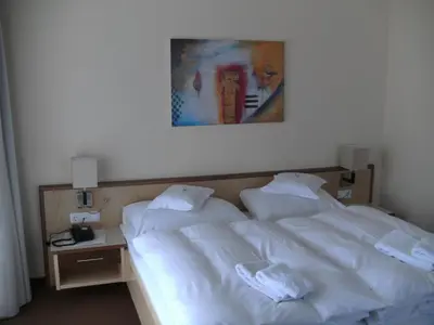 Ein Bett oder Betten in einem Zimmer der Unterkunft Hotel Sonneck