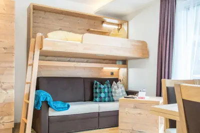 Ein Bett oder Betten in einem Zimmer der Unterkunft Appartements Hotel Gell