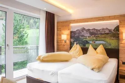 Ein Bett oder Betten in einem Zimmer der Unterkunft Appartements Hotel Gell