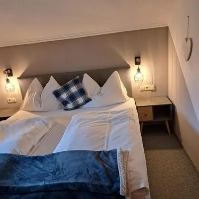 Ein Bett oder Betten in einem Zimmer der Unterkunft Palfengut