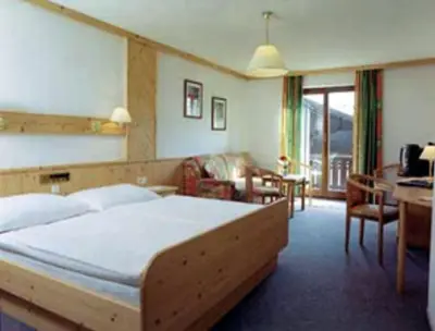 Ein Bett oder Betten in einem Zimmer der Unterkunft Hotel Hemetsberger