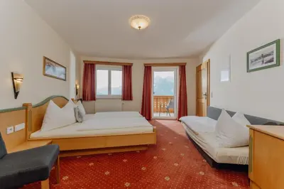 Ein Bett oder Betten in einem Zimmer der Unterkunft Apparthaus Taxegger