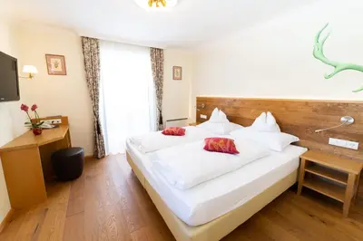 Ein Bett oder Betten in einem Zimmer der Unterkunft Aparthotel Hirschenau
