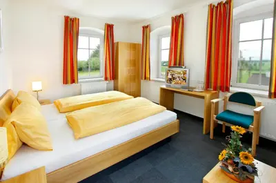 Ein Bett oder Betten in einem Zimmer der Unterkunft Gasthaus Kloibhofer