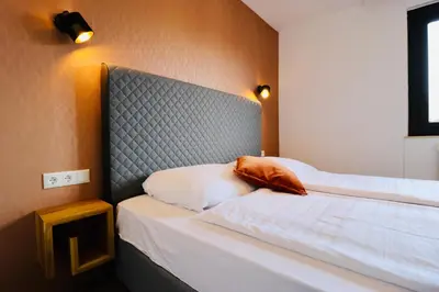Ein Bett oder Betten in einem Zimmer der Unterkunft Wolf & Schaf Apartments