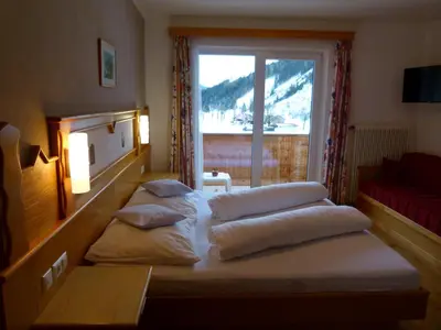 Ein Bett oder Betten in einem Zimmer der Unterkunft Montanara Apartment & Zimmer