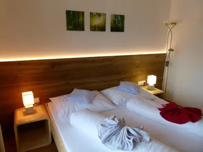 Ein Bett oder Betten in einem Zimmer der Unterkunft Montanara Apartment & Zimmer