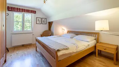 Ein Bett oder Betten in einem Zimmer der Unterkunft Ferienwohnung Neuper
