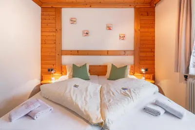 Ein Bett oder Betten in einem Zimmer der Unterkunft Panoramahotel Stocker