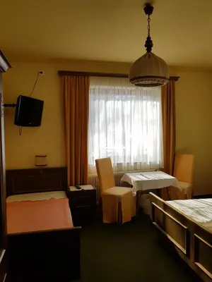 Ein Bett oder Betten in einem Zimmer der Unterkunft Hotel Restaurant Stigenwirth