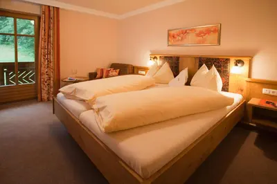 Ein Bett oder Betten in einem Zimmer der Unterkunft Wellness-Aparthotel Montana