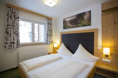 Ein Bett oder Betten in einem Zimmer der Unterkunft Hotel Ennskraxblick