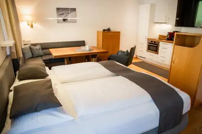 Ein Bett oder Betten in einem Zimmer der Unterkunft Aparthotel Pfeffermühle