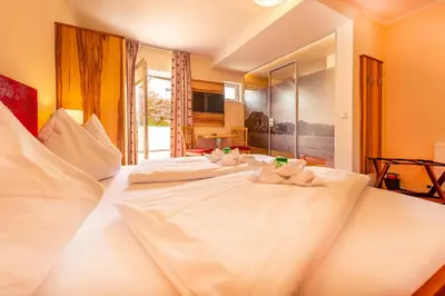 Ein Bett oder Betten in einem Zimmer der Unterkunft Panorama Hotel Traunstein