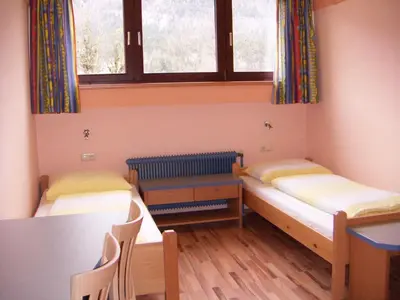Ein Bett oder Betten in einem Zimmer der Unterkunft Jutel Obertraun