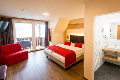 Ein Bett oder Betten in einem Zimmer der Unterkunft Hotel Gasthof Lercher