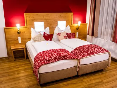 Ein Bett oder Betten in einem Zimmer der Unterkunft Landhotel Timmerer