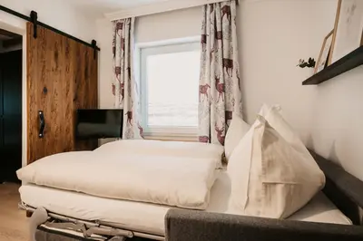 Ein Bett oder Betten in einem Zimmer der Unterkunft Flasch Appart-Pension