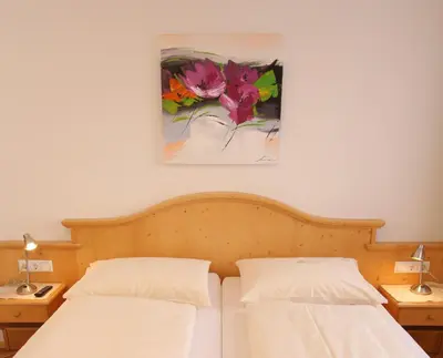 Ein Bett oder Betten in einem Zimmer der Unterkunft Bio-Bauernhof-Hotel Matlschweiger