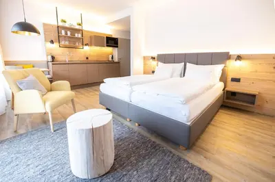 Ein Bett oder Betten in einem Zimmer der Unterkunft Dormio Aparthotel Hinterstoder