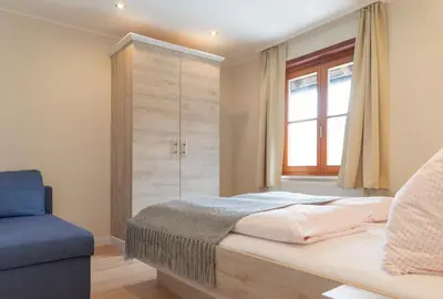 Ein Bett oder Betten in einem Zimmer der Unterkunft Arndt's Bootshaus