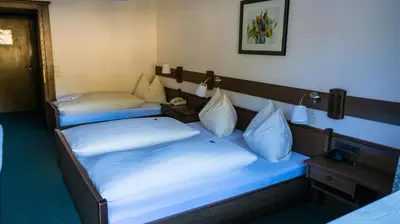 Ein Bett oder Betten in einem Zimmer der Unterkunft Pension Ebnerwirt