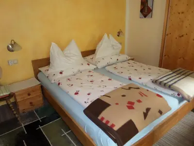 Ein Bett oder Betten in einem Zimmer der Unterkunft Kalcherhof