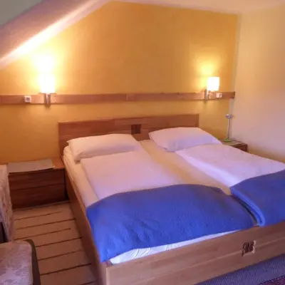 Ein Bett oder Betten in einem Zimmer der Unterkunft Kalcherhof