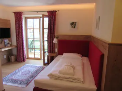 Ein Bett oder Betten in einem Zimmer der Unterkunft Hollwegers Landhaus - Das Lisl