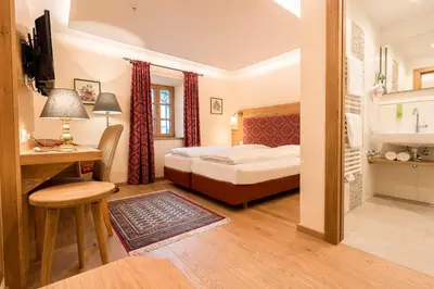 Ein Bett oder Betten in einem Zimmer der Unterkunft Hollwegers Landhaus - Das Lisl