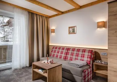 Ein Sitzbereich in der Unterkunft Apartments & Garni Alpenrose