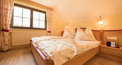 Ein Bett oder Betten in einem Zimmer der Unterkunft Pension Firn Sepp