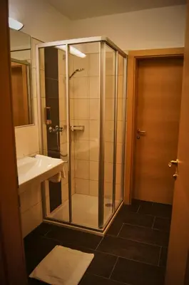 Ein Badezimmer in der Unterkunft Hotel-Restaurant Schwaiger***