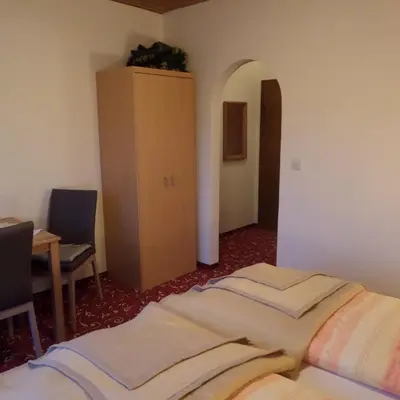 Ein Bett oder Betten in einem Zimmer der Unterkunft Gästehaus ERLE