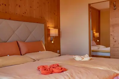 Ein Bett oder Betten in einem Zimmer der Unterkunft Hotel Garni Hochwurzen