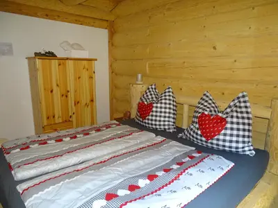 Ein Bett oder Betten in einem Zimmer der Unterkunft C.T.N. Loghouse