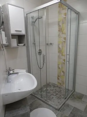 Ein Badezimmer in der Unterkunft C.T.N. Loghouse