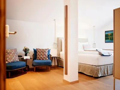 Ein Bett oder Betten in einem Zimmer der Unterkunft TAUROA Seehotel Grundlsee