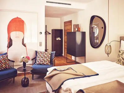 Ein Bett oder Betten in einem Zimmer der Unterkunft TAUROA Seehotel Grundlsee