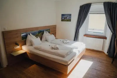 Ein Bett oder Betten in einem Zimmer der Unterkunft Hotel Restaurant DAS RÖSSL