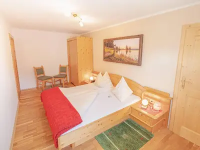 Ein Bett oder Betten in einem Zimmer der Unterkunft Zeiserhof