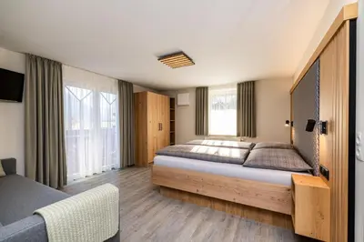 Ein Bett oder Betten in einem Zimmer der Unterkunft Haus Meneweger
