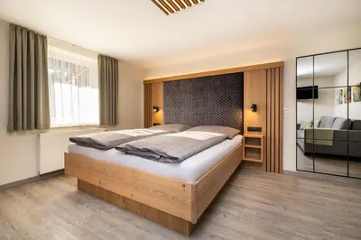 Ein Bett oder Betten in einem Zimmer der Unterkunft Haus Meneweger